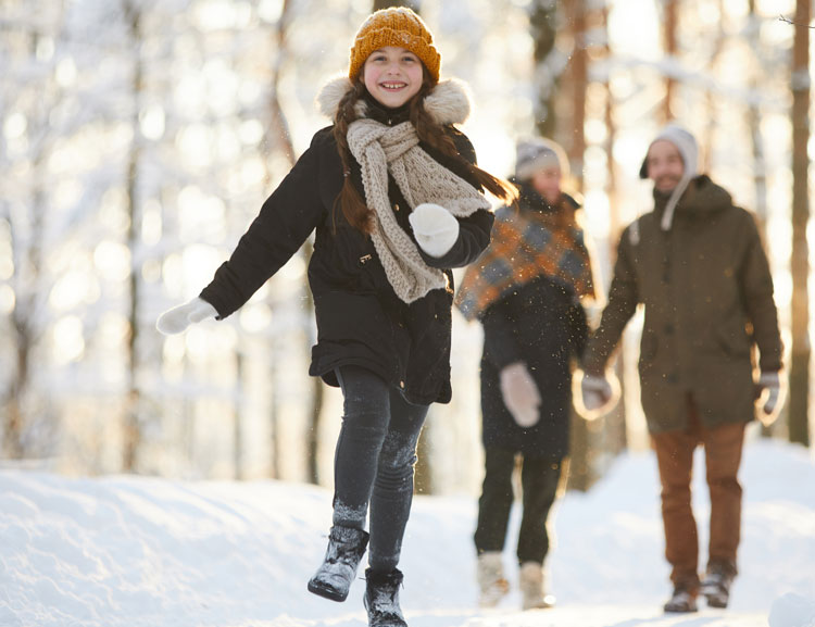 Child and Parents walking in snow